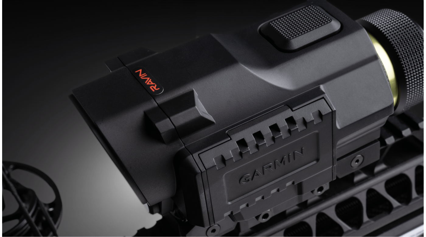 Close-up of rangefinding scope body showing tactile top buttons and housing detail