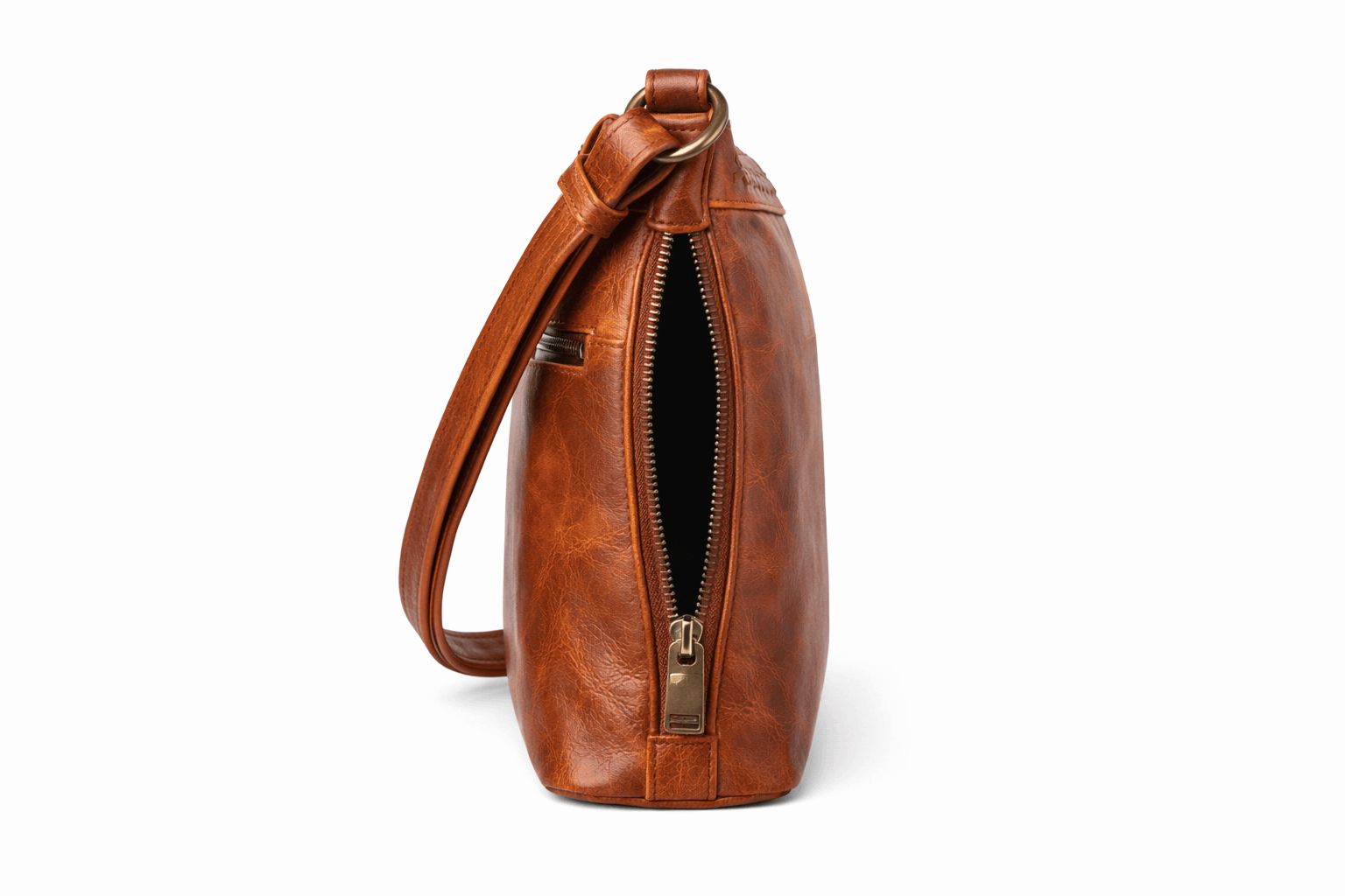 Side view of the Concealed Carry Faith Leather Crossbody in Cognac showing concealment zipper access