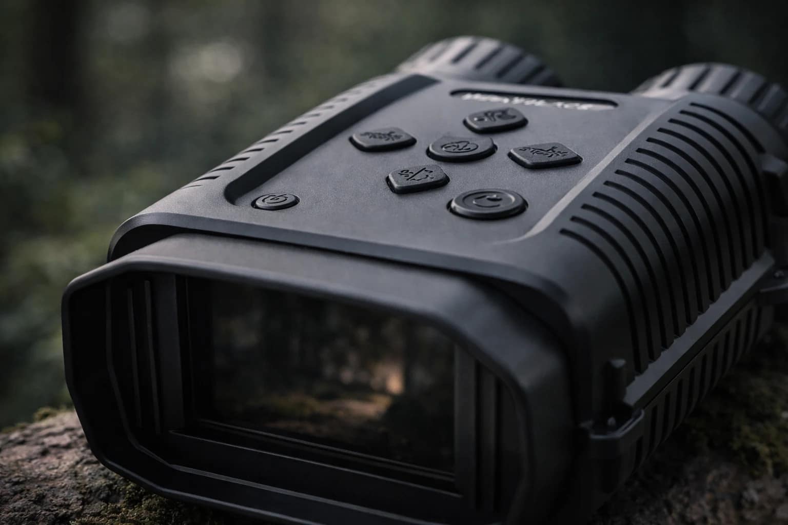 Close-up of the top buttons and recessed screen hood on compact night vision binoculars