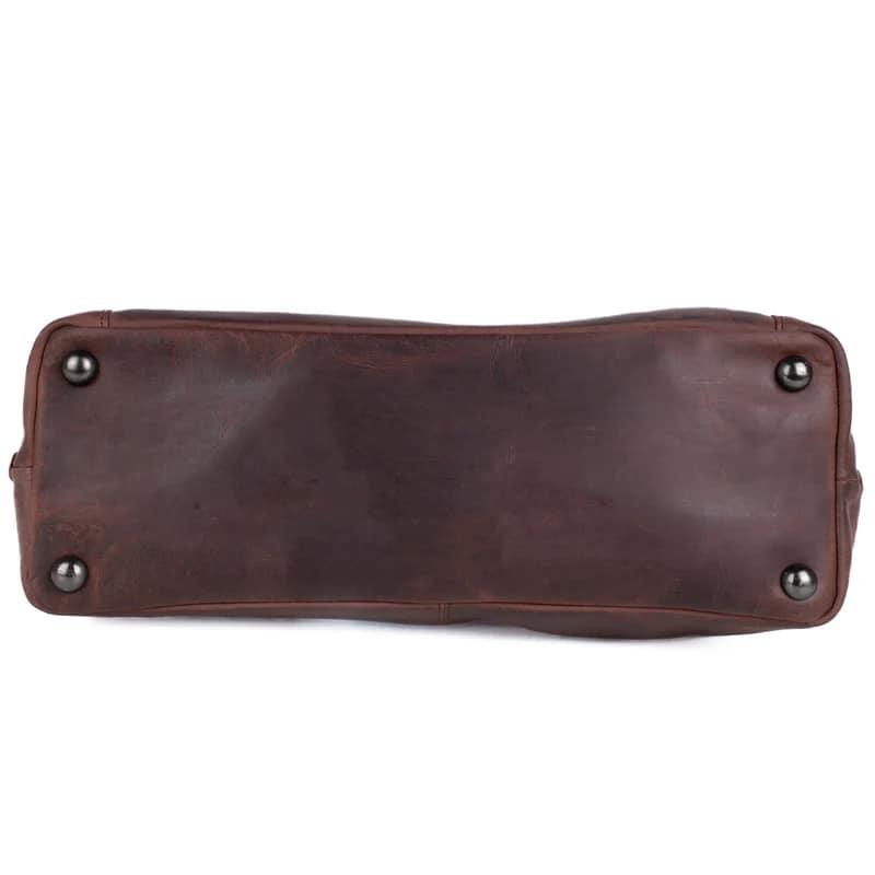 Bottom view of Norah Leather Tote showing four protective metal studs